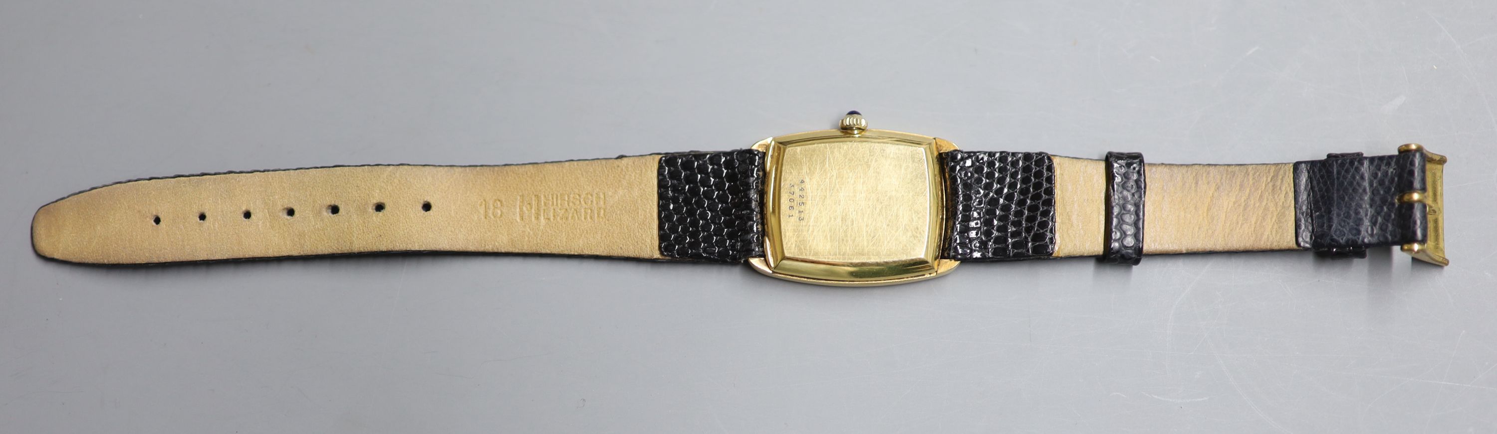 A gentlemans stylish 18k Baume & Mercier manual wind dress wrist watch, on associated leather strap,